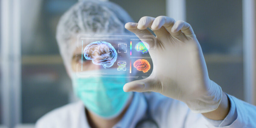 A physician, surgeon, examines a technological digital holographic plate represented the patient's body, the heart lungs, muscles, bones. Concept: Futuristic medicine, the human body, and the future.